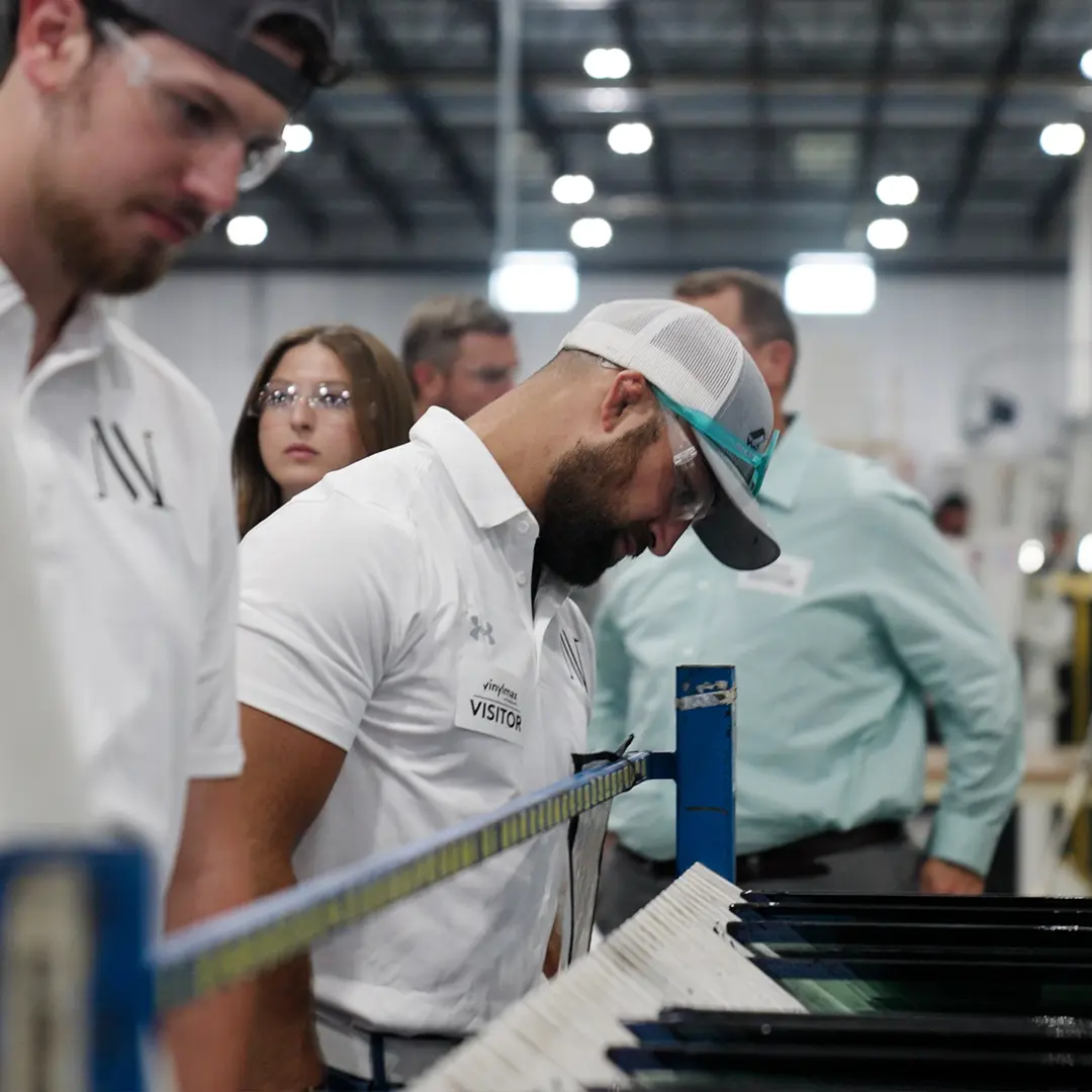 2 window contractors in white doing inspections